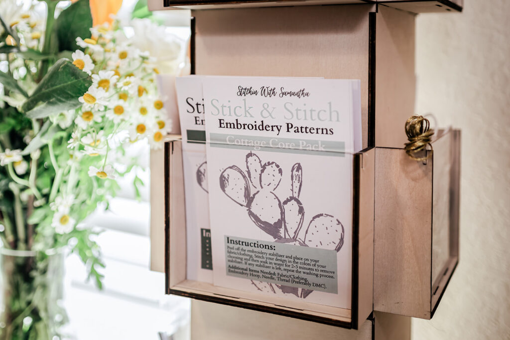 Stick & Stitch embroidery pattern kits on display.