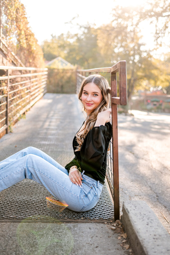 Two outfit options for a senior photo session including jeans, black shirt, and dress with hat.